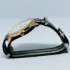 Side profile of men's white dial analog watch with NATO strap