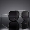 Luxury sunglasses with reflective lenses on minimal background