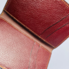 minimalist-wallet-product.jpg Maroon leather wallet with gold stitching
