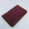 wallet-front-view.jpg Maroon leather wallet with gold stitching