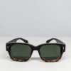 MIGNON FB (1) Close-up of tortoiseshell fade frame with green tinted lens