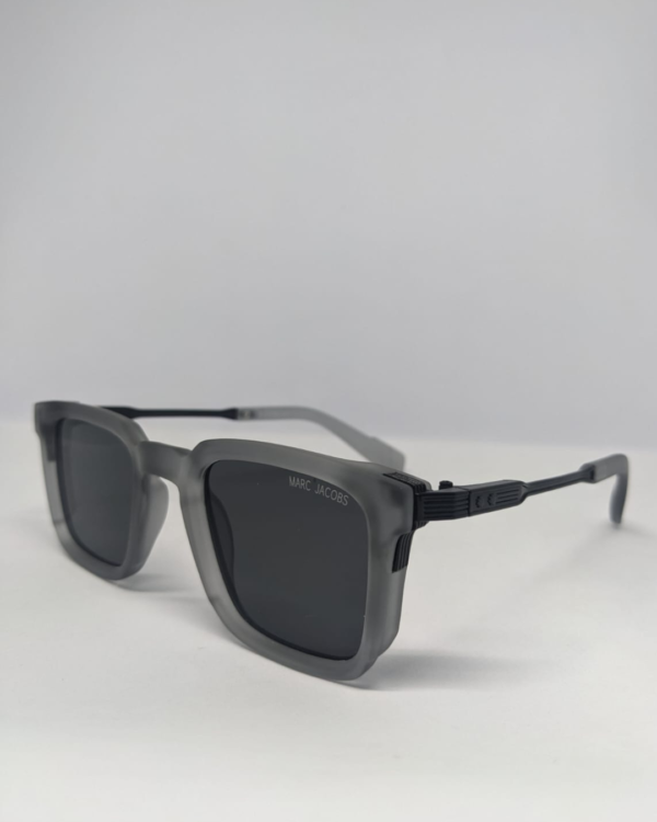 Close-up of metal temple arm on square matte grey sunglasses