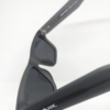 Close-up of dark smoke grey flat tinted lens on square sunglasses