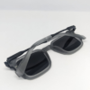 Square matte grey sunglasses with protective case and cloth