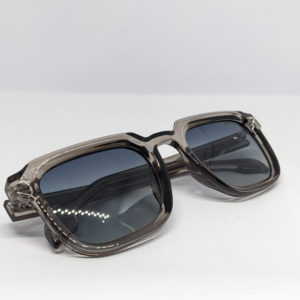 Close-up of gradient blue-grey tinted lens on square sunglasses