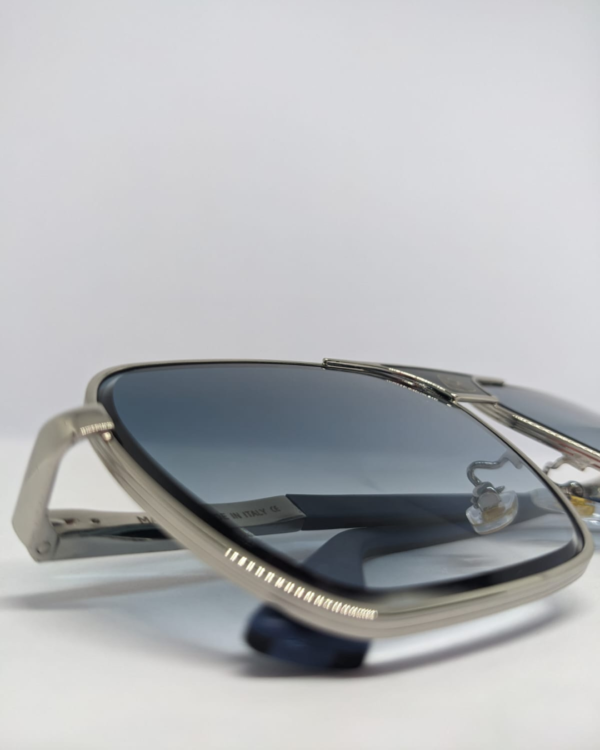 Close-up of blue gradient flat lens on square aviator sunglasses