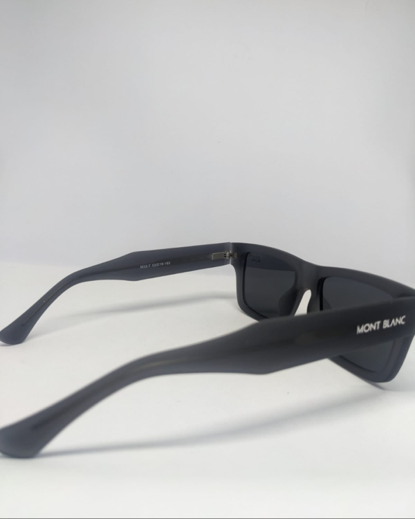 Side angle of flat-top square sunglasses, matte black finish