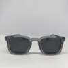 Man wearing square matte grey sunglasses casual outdoor style