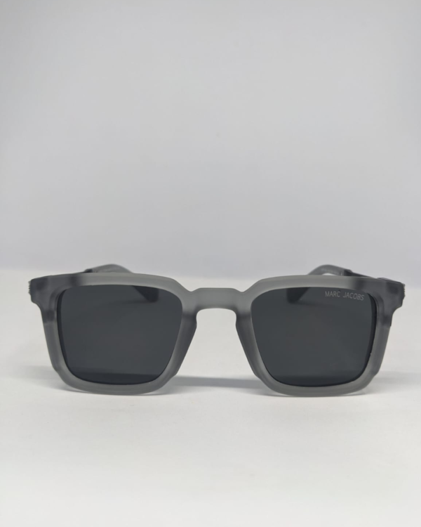 Man wearing square matte grey sunglasses casual outdoor style
