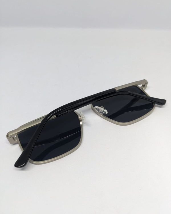 MIGNON FB (8) Close-up of silver metal temple arm on navigator sunglasses
