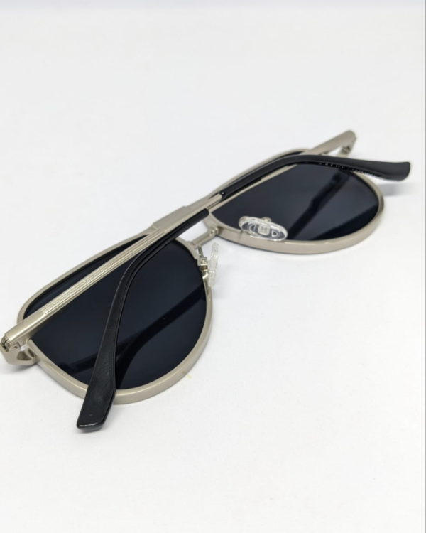 MIGNON FB (8) Aviator silver metal frame sunglasses with black temple arms folded flat lay