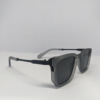 Square matte grey sunglasses folded flat lay