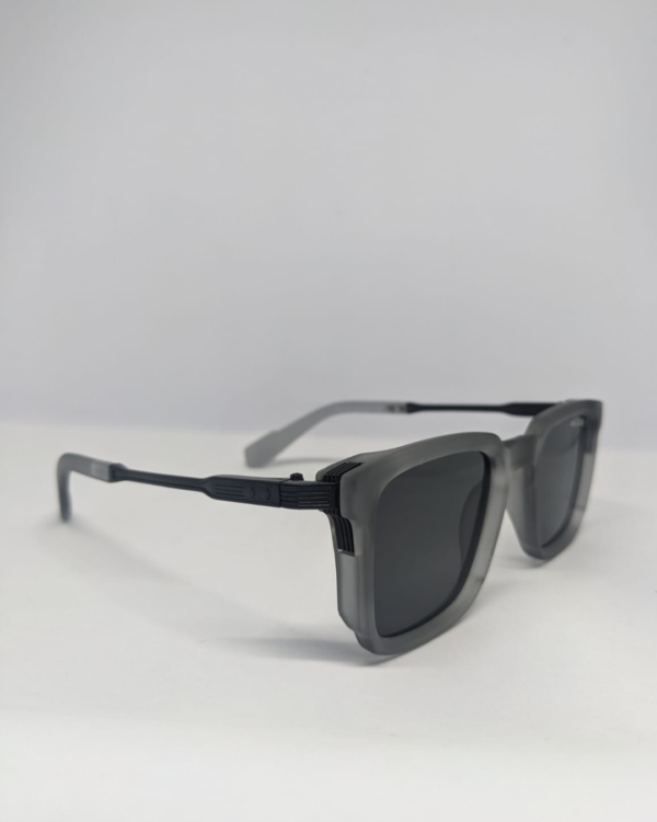 Square matte grey sunglasses folded flat lay