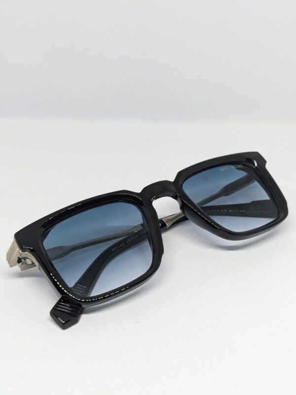 Square frame acetate sunglasses with blue gradient lens folded flat lay